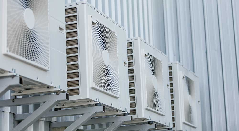 Closeup of air conditioners installed on the outside